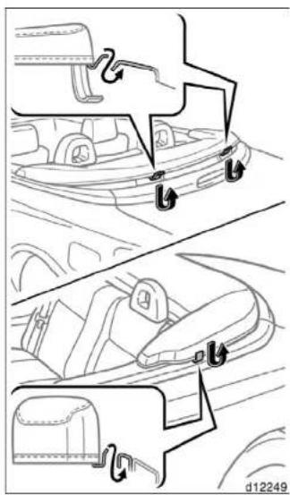 Technical diagram showing car seatbelt components with labeled parts and directional arrows indicating movement or assembly.
