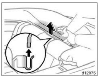 Diagram showing a mechanical component with an arrow indicating direction, including a magnified inset of a U-shaped pipe or tube.