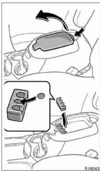 Diagram illustrating car seatbelt adjustment with labeled parts and directional arrows