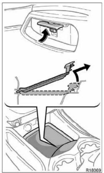 Diagram illustrating car seatbelt mechanism with directional arrows and a highlighted lever mechanism