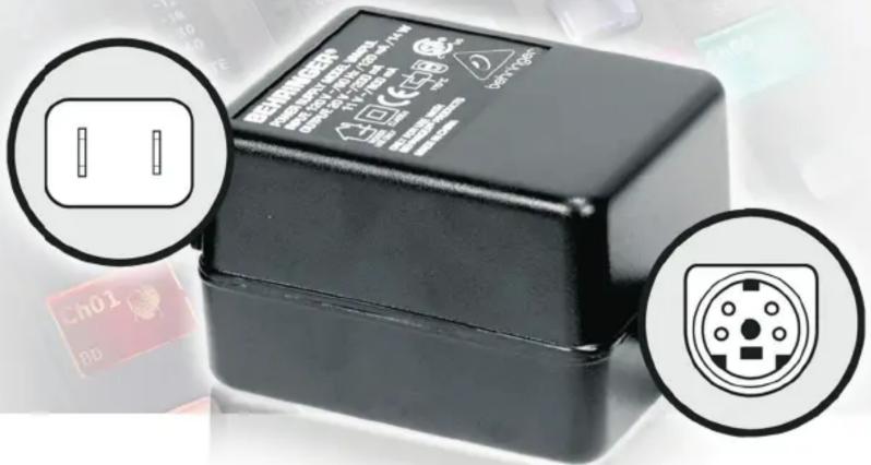 Close-up of a black electronic device with two circular annotations highlighting internal components and labels.