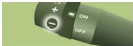Close-up of a device control knob with ON/OFF buttons and a plus/minus icon, likely from an electronic device interface.