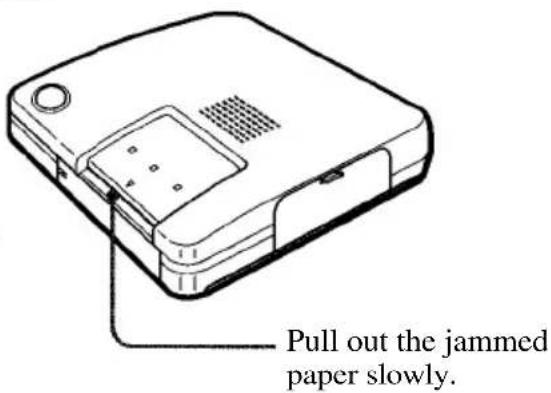 OLYMPUS Camedia P-330 - Remove the jammed paper from the paper inlet on the front panel - 1