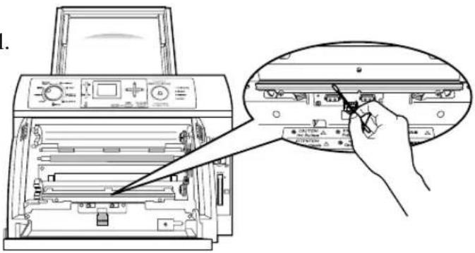 Diagram showing printer operation with a hand inserting a component into the main panel, highlighting internal components and status indicators.