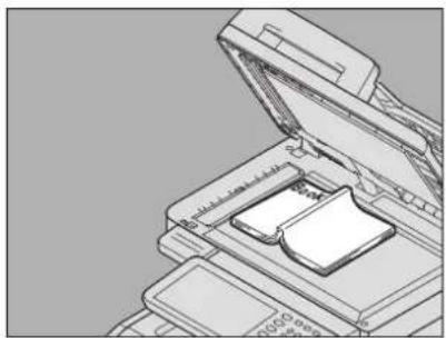 OKI MC780f+ - Open the desired page of the original and place it with its face down. Align it with the left rear corner of the document glass. - 1