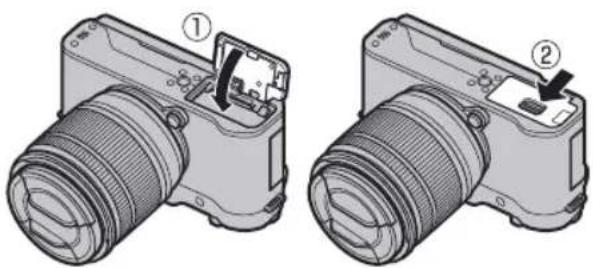 FUJIFILM X-A20 - Close the battery-chamber cover. - 1