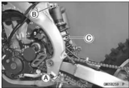 KAWASAKI KLX450R (2011) - When pulling out the mounting bolts, lift the rear wheel slightly. Forcing or tapping on a bolt could damage the bolt, sleeve, and bearing - 1