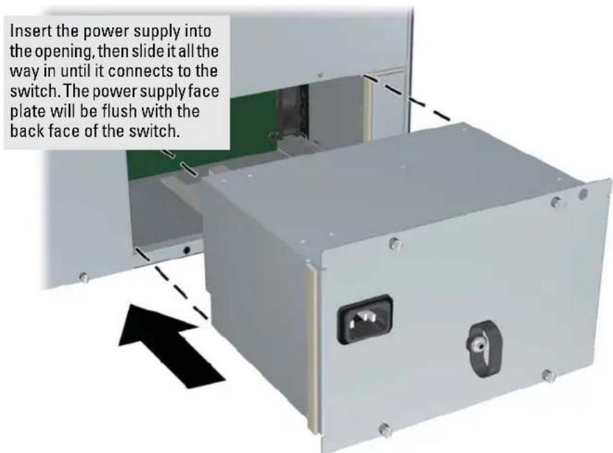 Insert the power supply into the opening, then slide it all the way in until it connects to the switch. The power supply face plate will be flush with the back face of the switch.