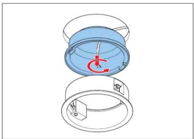 Diagramm einer mechanischen Vorrichtung mit blauer Kuppel und rotierender Komponente, das interne Rotationspfeile zeigt (ohne Text oder Symbole).