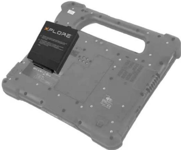 Exterior view of a gray laptop chassis with a black XPLORE chip mounted on its side (no text or symbols visible)