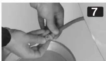 Close-up of hands performing a finger manipulation task in a bowl (no visible text or symbols)