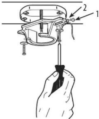 Technical diagram showing a mechanical assembly with labeled parts 1 and 2, including a hand holding a tool.