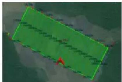 Aerial or satellite image showing a green rectangular area with overlaid numerical labels and a red arrow pointing to a specific location.