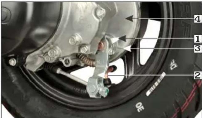 Labeled mechanical diagram of a vehicle wheel assembly with numbered parts and component annotations
