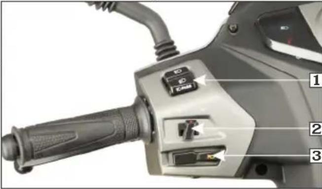 Close-up of a motorcycle's front and side control panel with labeled buttons and adjustment knobs