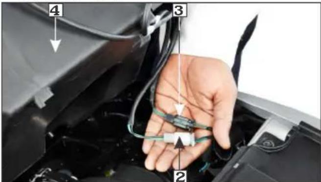 Close-up of a car interior with numbered annotations pointing to components like cable, wires, and connectors.