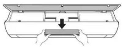 Diagram of hands installing a component into a device inside a box (no text or symbols)