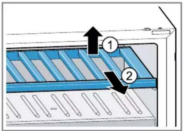 Diagram of a device with labeled components and directional arrows indicating assembly or process flow