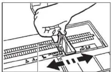 Diagram showing a hand using a tool to cut or mark a ruler with measurement markings and directional arrows indicating alignment or adjustment.