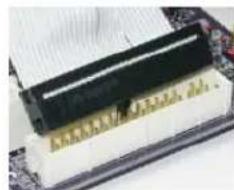 Close-up of a computer RAM module with gold contacts and a black top panel, placed on a circuit board (no visible text or symbols)