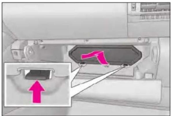 Diagram showing a device with labeled components and an arrow pointing to a connector, likely indicating a process or connection.