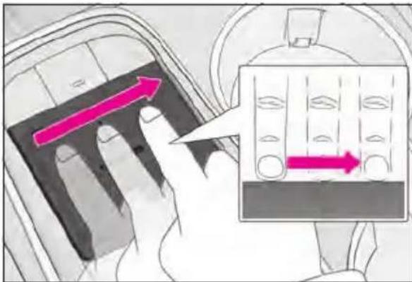 Diagram showing a hand pressing a component with an arrow indicating direction, alongside a magnified view of a device with internal components.