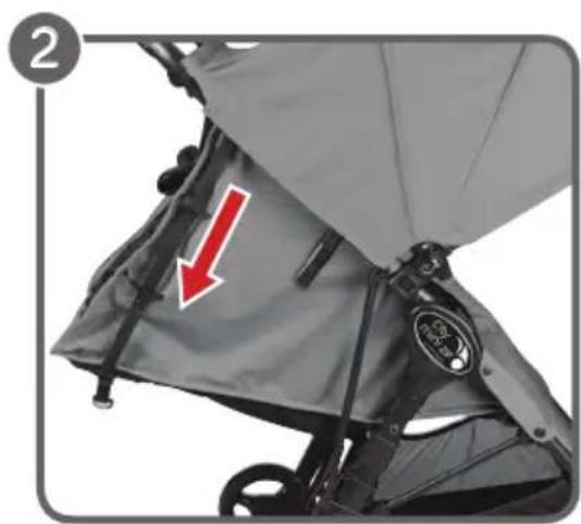 Close-up of a gray stroller with a red arrow pointing to the seat area, no visible text or symbols