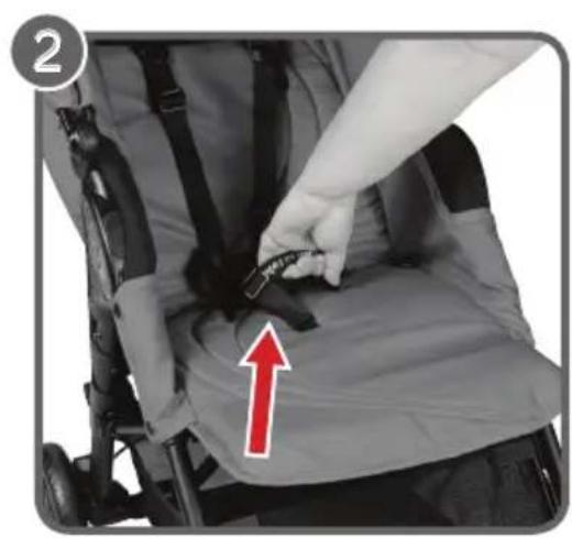 Close-up of a baby stroller with a hand adjusting the seatbelt, showing a red arrow pointing to the seat area (no text or symbols visible)