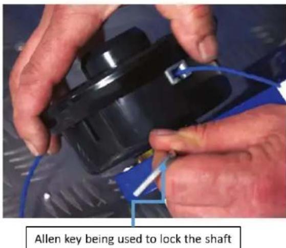 Allen key being used to lock the shaft
