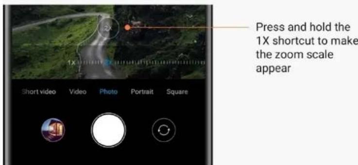 Press and hold the 1X shortcut to make the zoom scale appear.