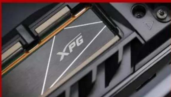 Close-up of a black electronic device with a white triangular logo and 'XPG' branding, no readable text or symbols beyond the logo.