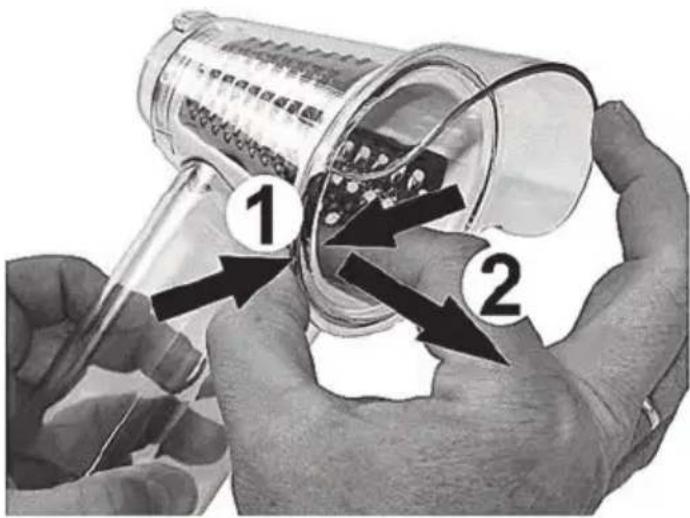 Diagram showing hands using a magnifying glass to inspect a container with labeled parts, including numbered annotations.