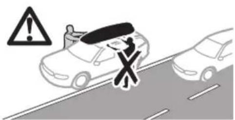 Warning sign showing a person holding a car with a cross symbol, indicating no hazard or absence of a vehicle.