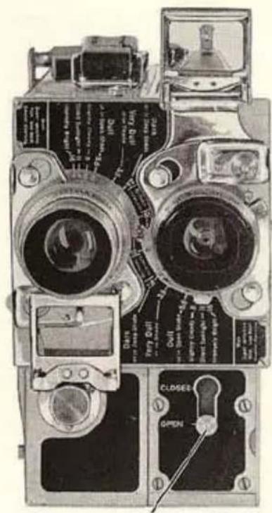 Technical diagram of a vintage camera with labeled parts and control buttons
