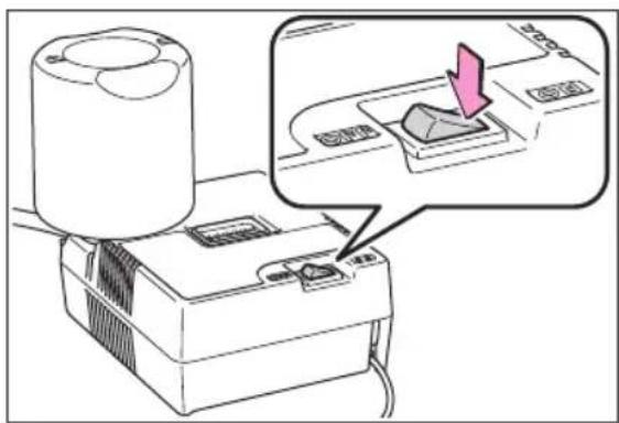 Diagram showing a printer with a magnified view of the printer's internal structure, highlighting a pink arrow pointing to its component.