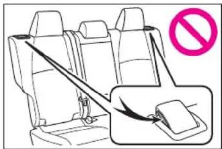 Diagram showing seatbelting instruction with a no-smoking symbol and magnified view of the seatbelt being inserted.