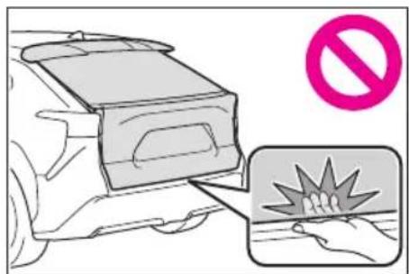 Diagram illustrating a car safety hazard with a no-smoking symbol and a hand holding a contact.