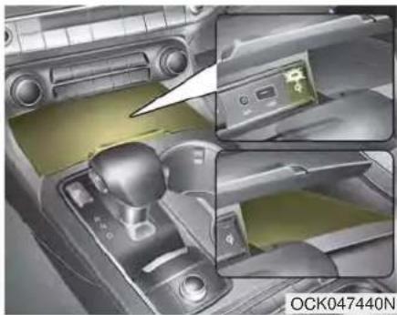 Interior view of a car gear shift lever and dashboard (no visible text or symbols)