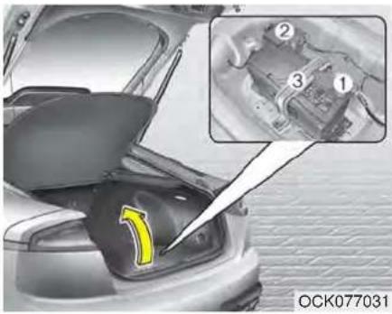Close-up of a car's front bumper with a yellow arrow pointing to the nose area, showing mechanical components (no text or symbols visible)