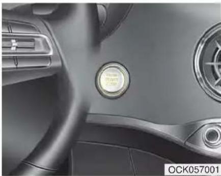 Interior view of a car dashboard with steering wheel and circular vent (no visible text or symbols)