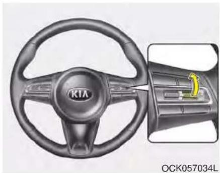 Interior view of a car steering wheel with visible brand logo and control panel (no text or symbols on the diagram itself)