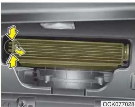 Close-up of a mechanical component with yellow directional arrows indicating flow or movement, no visible text or symbols.