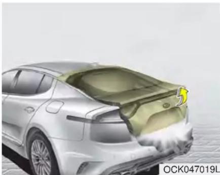 Side view of a silver sedan with visible engine compartment and exhaust plume (no text or symbols)