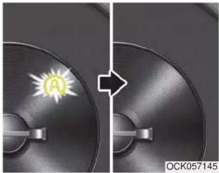 Close-up of two circular discs with a glowing 'A' symbol, one showing a white arrow pointing to its side (no text or symbols on discs)