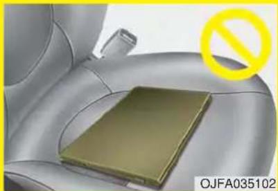 Interior view of a car seat with a yellow prohibition symbol overlay (no readable text or symbols on the main subject)