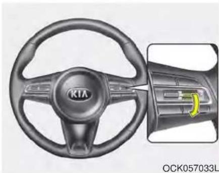 Interior view of a car steering wheel with visible brand logo and control panel (no text or symbols on the diagram itself)