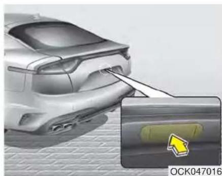 3D rendering of a car rear bumper with a highlighted sensor or sensor component (no text or symbols visible)