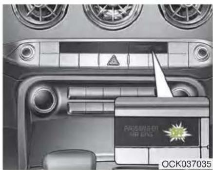 Interior view of a car dashboard with air vent, steering wheel, and a central touchscreen display (no readable text or symbols)