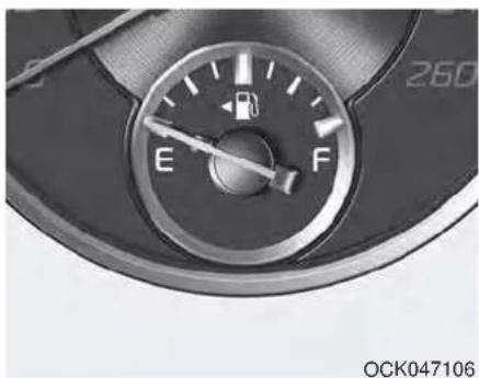 Close-up of a car fuel meter dial with E and F indicators (no text or symbols beyond labels)