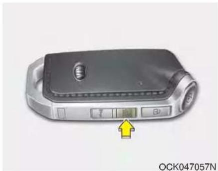 Close-up of a smart device with control buttons and a yellow arrow pointing to it (no readable text or symbols)